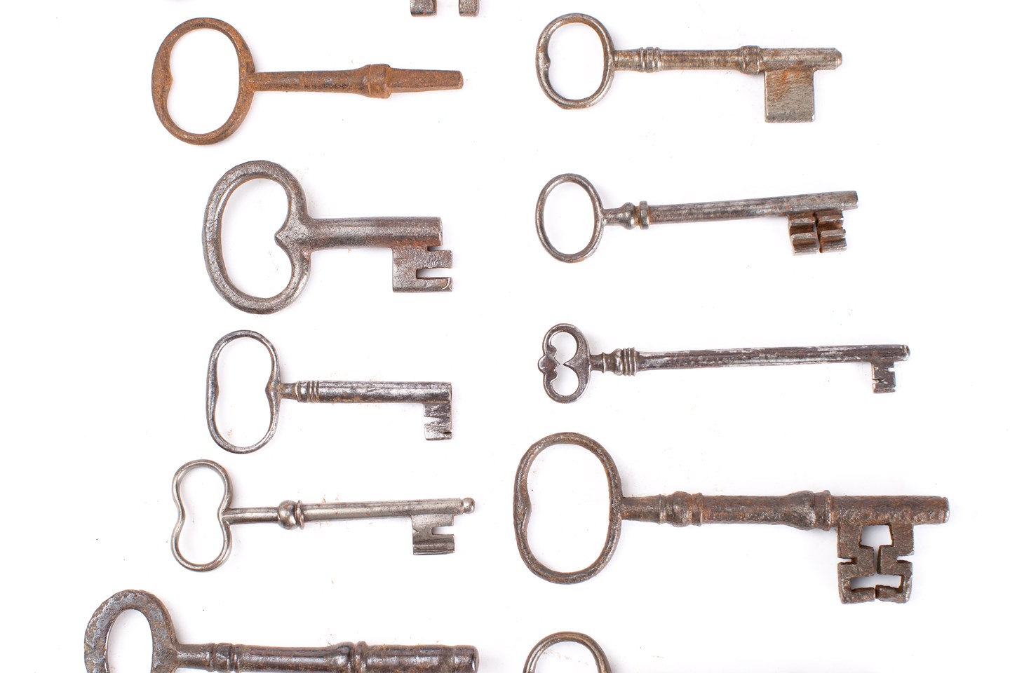 A group of twelve various steel keys, both English and French: including two blank keys 